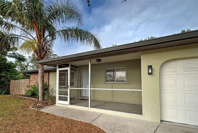 doorway to property featuring a garage