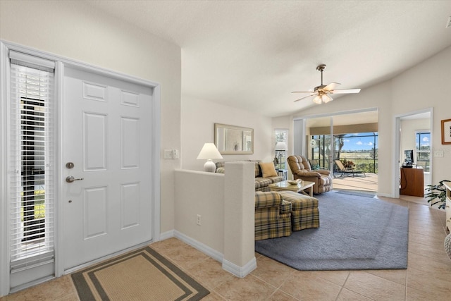 tiled entryway featuring ceiling fan