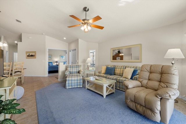 living room featuring ceiling fan, light tile patterned flooring, and vaulted ceiling