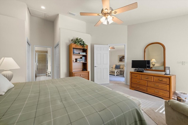 carpeted bedroom with ceiling fan and a high ceiling