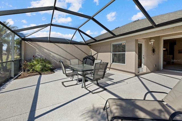 view of patio featuring a lanai