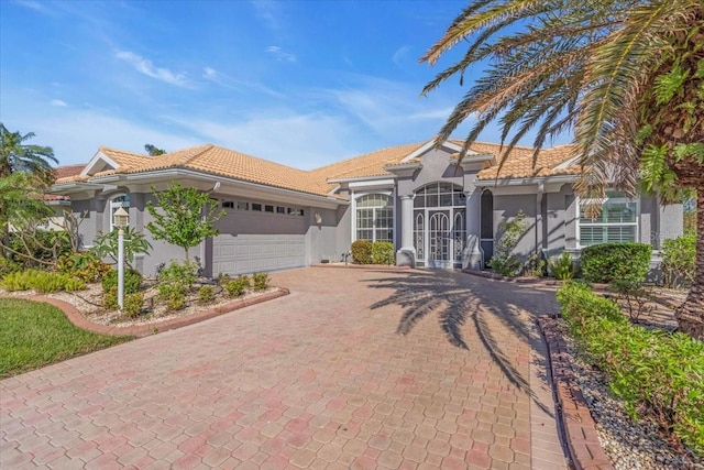 view of front of property with a garage