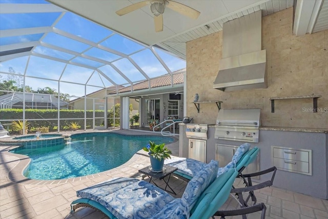 view of pool with an in ground hot tub, an outdoor kitchen, a lanai, a patio area, and a grill