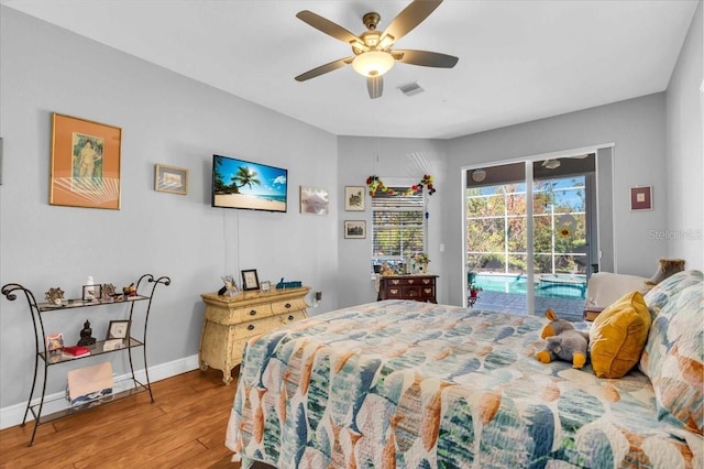 bedroom with hardwood / wood-style flooring, ceiling fan, and access to exterior