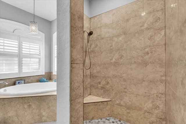 bathroom with separate shower and tub