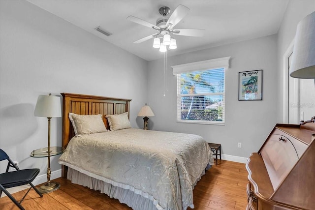 bedroom featuring light hardwood / wood-style flooring and ceiling fan