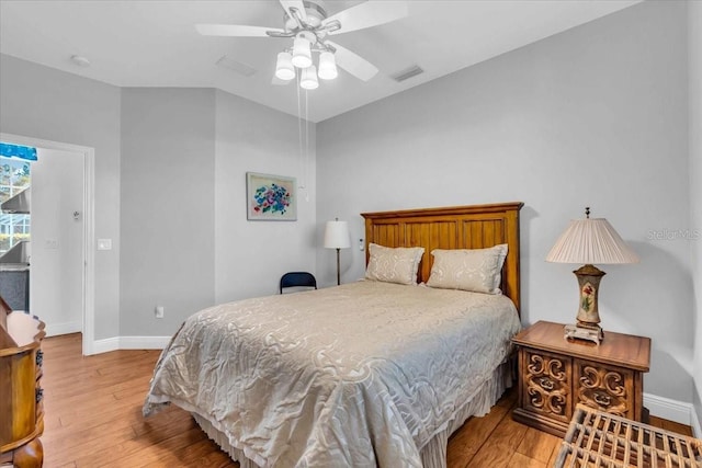 bedroom with ceiling fan and light wood-type flooring