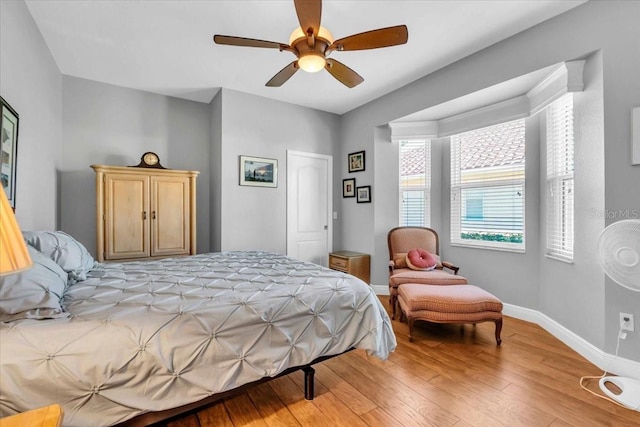 bedroom with hardwood / wood-style flooring and ceiling fan