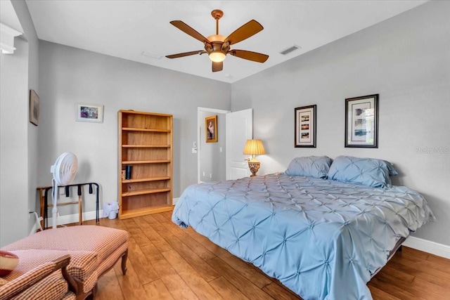 bedroom featuring ceiling fan and light hardwood / wood-style flooring