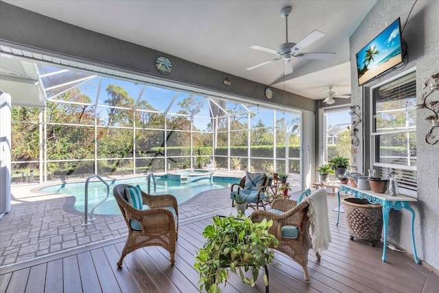 sunroom / solarium with ceiling fan and a pool