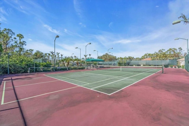 view of sport court with basketball hoop