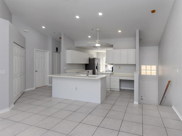 kitchen with stainless steel fridge with ice dispenser, white cabinets, light tile patterned floors, and ceiling fan