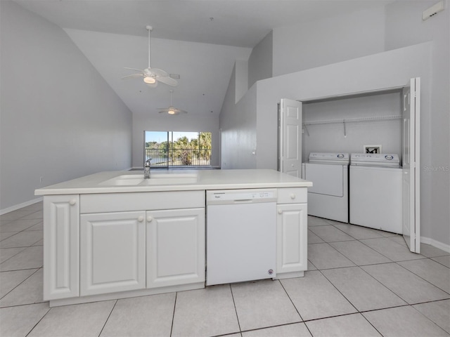 kitchen featuring white dishwasher, white cabinets, sink, and an island with sink