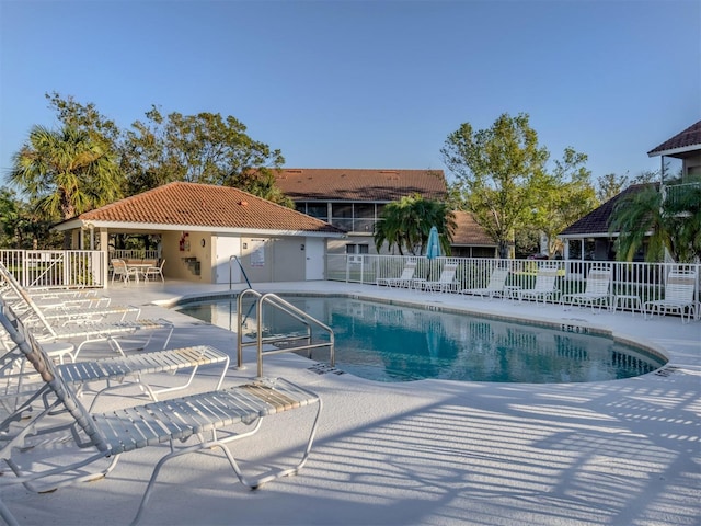 view of swimming pool featuring a patio area