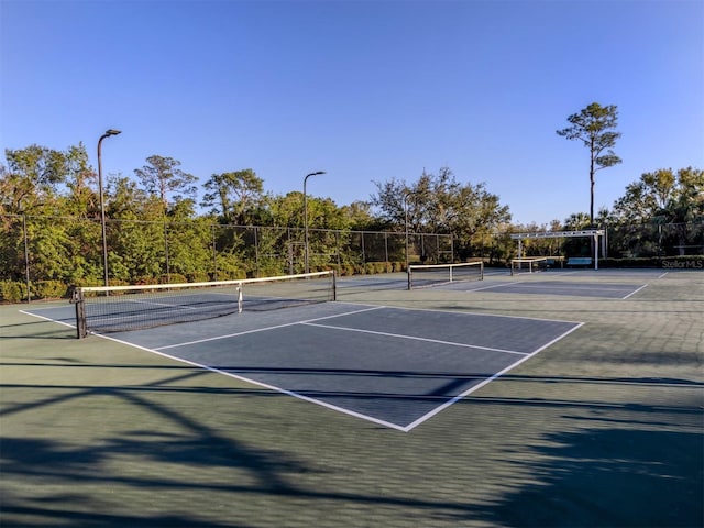 view of sport court featuring basketball hoop