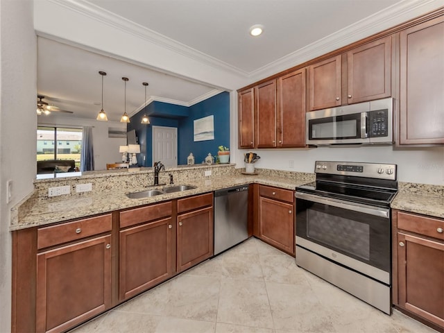 kitchen with pendant lighting, sink, ceiling fan, ornamental molding, and stainless steel appliances