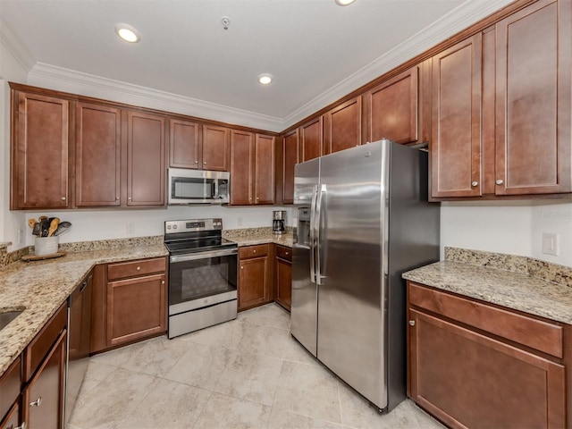 kitchen featuring stainless steel appliances, light stone counters, and crown molding