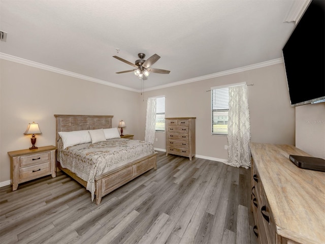 bedroom featuring wood-type flooring, ceiling fan, and ornamental molding