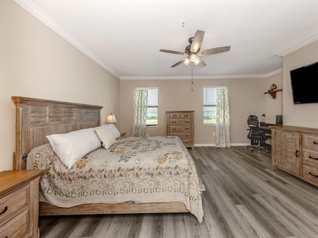 bedroom featuring wood-type flooring, ceiling fan, and ornamental molding