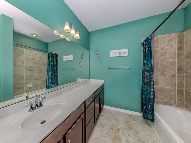 bathroom with tile patterned floors, shower / bath combo with shower curtain, and vanity