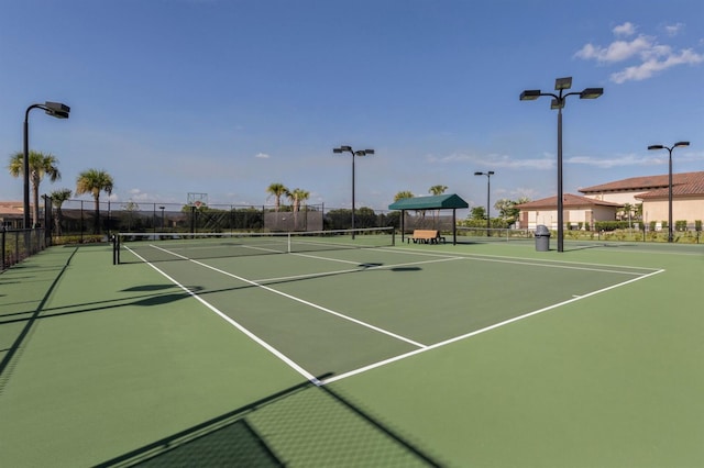 view of sport court with basketball hoop