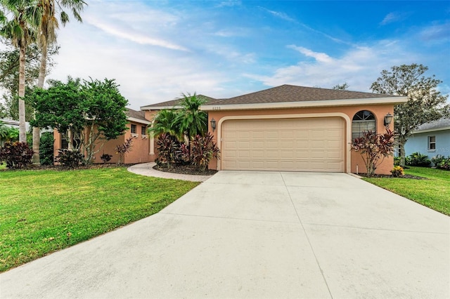 single story home with a garage and a front lawn