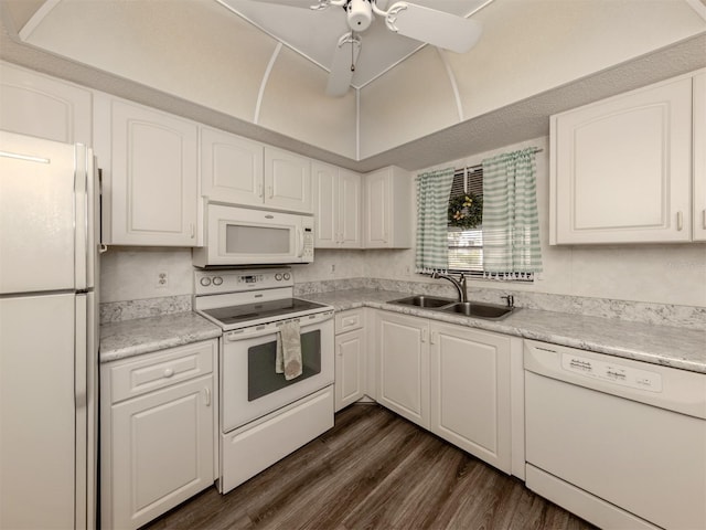 1708 Bonitas Cir Unit 1726A, Venice, FL 34293 - kitchen featuring white appliances, a sink, dark wood-style floors, white cabinetry, and light countertops