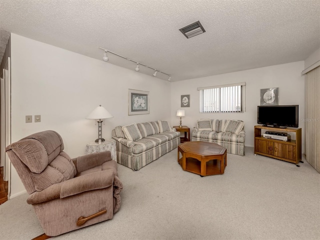 1708 Bonitas Cir Unit 1726A, Venice, FL 34293 - carpeted living area with a textured ceiling and track lighting
