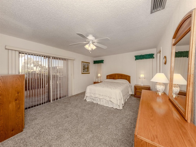 bedroom with carpet flooring, a textured ceiling, and ceiling fan