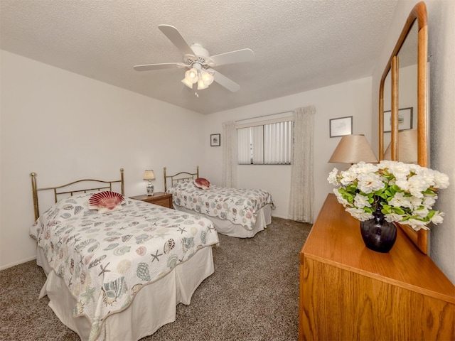 carpeted bedroom with ceiling fan and a textured ceiling