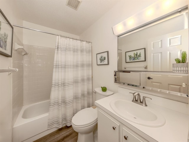 1708 Bonitas Cir Unit 1726A, Venice, FL 34293 - bathroom with toilet, vanity, shower / bathtub combination with curtain, and wood finished floors