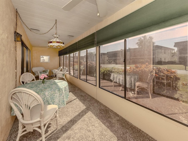1708 Bonitas Cir Unit 1726A, Venice, FL 34293 - sunroom with a ceiling fan and carpet flooring