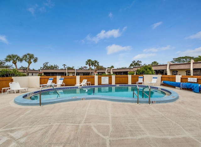 view of swimming pool with a patio