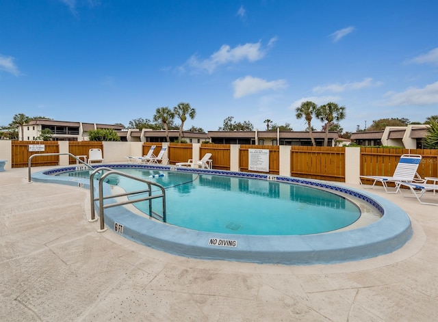 view of swimming pool with a patio area