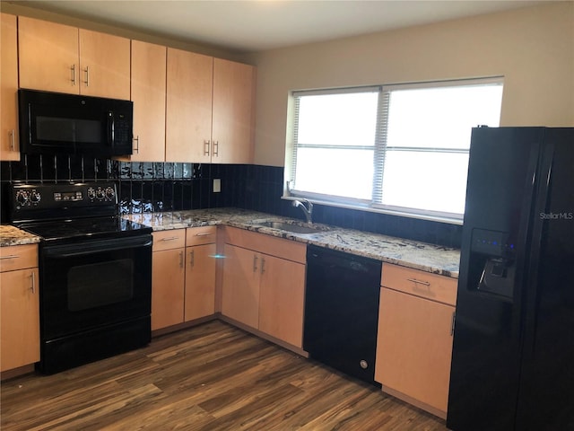 kitchen with dark hardwood / wood-style flooring, sink, light brown cabinetry, and black appliances