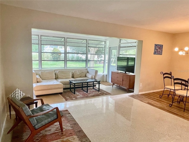 living room with wood-type flooring and a notable chandelier