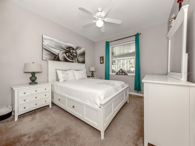 bedroom featuring ceiling fan and light carpet