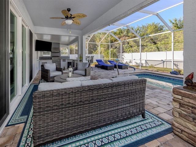 view of patio featuring an outdoor kitchen, an outdoor living space, ceiling fan, glass enclosure, and a fenced in pool