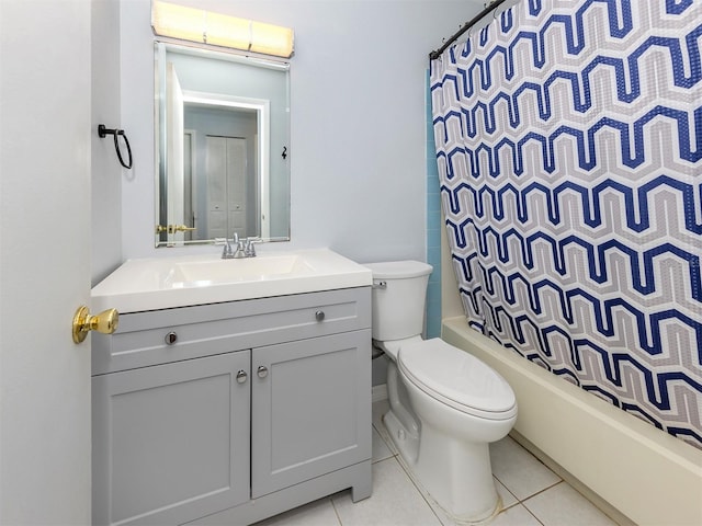 full bathroom with tile patterned floors, vanity, shower / tub combo, and toilet