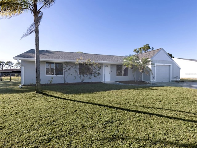 3181 Nekoosa St, North Port, FL 34287 - ranch-style home featuring a garage and a front lawn