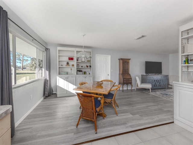 dining room with light wood-type flooring