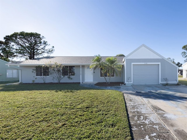 single story home featuring a front yard and a garage