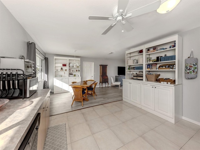 interior space with ceiling fan and light hardwood / wood-style flooring