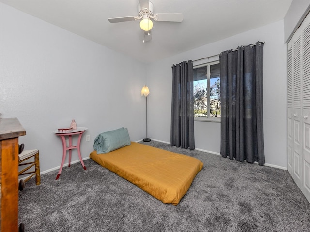 carpeted bedroom featuring a closet and ceiling fan