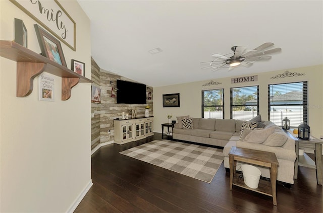 living room with dark hardwood / wood-style floors, ceiling fan, and lofted ceiling