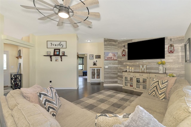 living room featuring vaulted ceiling, ceiling fan, and dark hardwood / wood-style floors