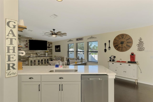 kitchen featuring dark hardwood / wood-style flooring, ceiling fan, sink, dishwasher, and white cabinetry