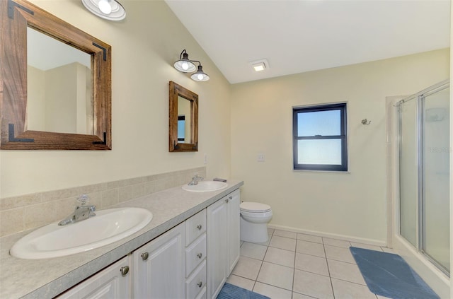 bathroom featuring tile patterned floors, vanity, an enclosed shower, and toilet