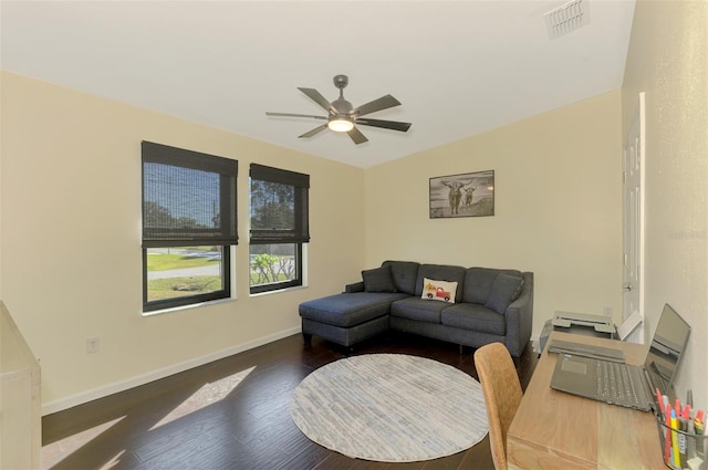 living room featuring dark hardwood / wood-style flooring and ceiling fan