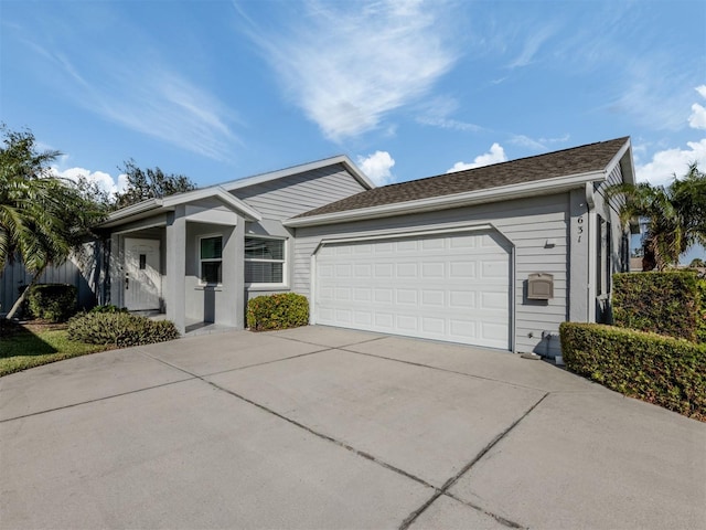 ranch-style house featuring a garage